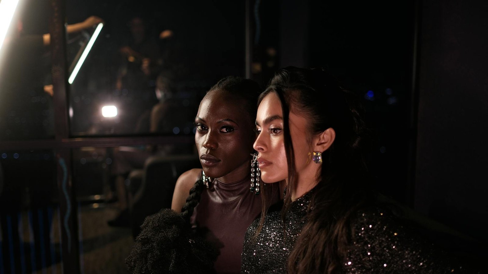 celebrity style inspiration - Elegant women in fashionable attire captured at a chic evening event.