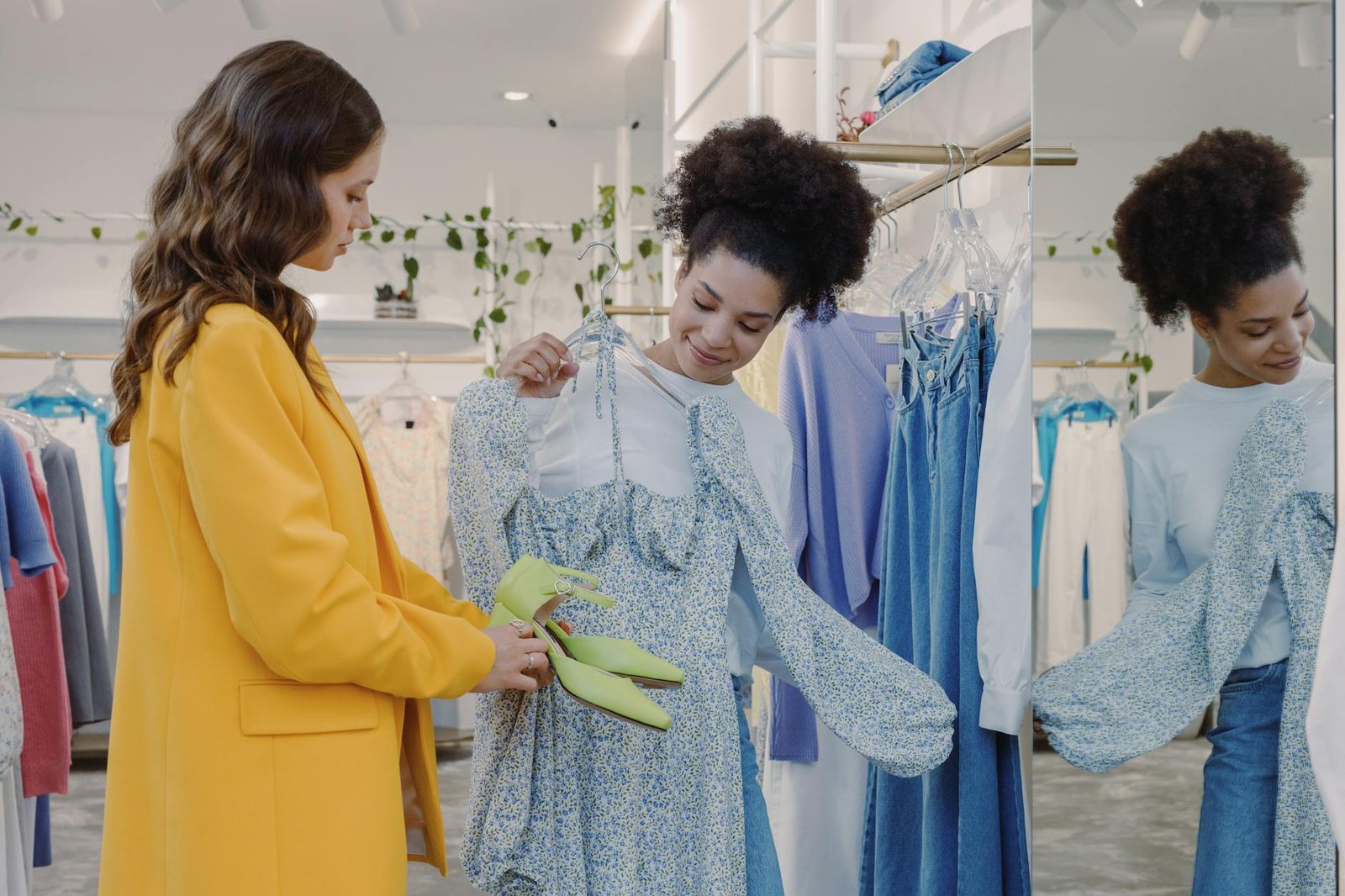fashion trends for women - Two women exploring stylish clothing in a trendy boutique. Perfect for fashion and shopping concepts.