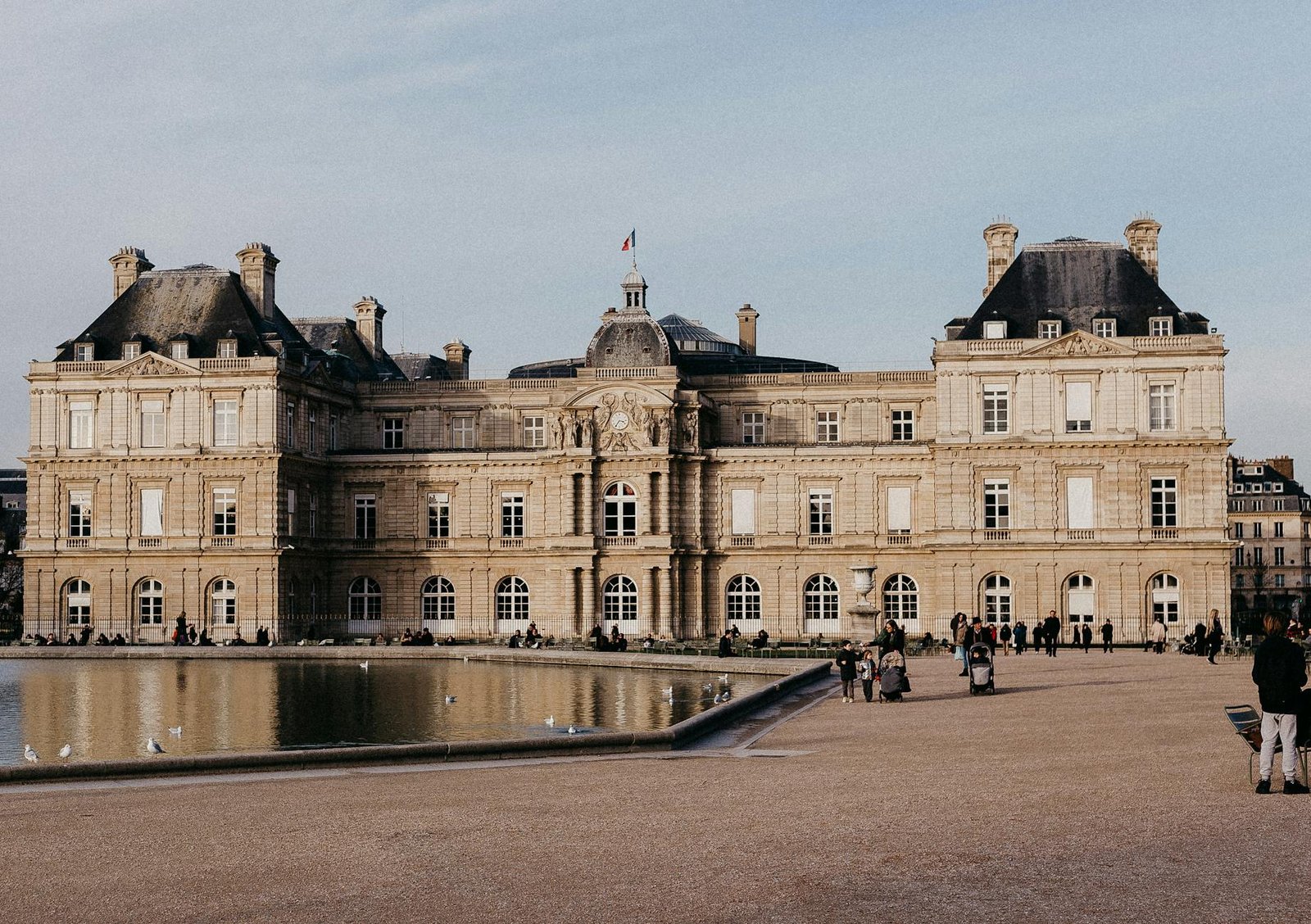 french style inspiration - Luxembourg Palace reflecting in the water during daylight in Paris, France. Historic architecture, scenic view.