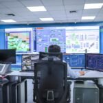 technology - Operator in a modern control room managing technological systems in El Agustino, Lima.