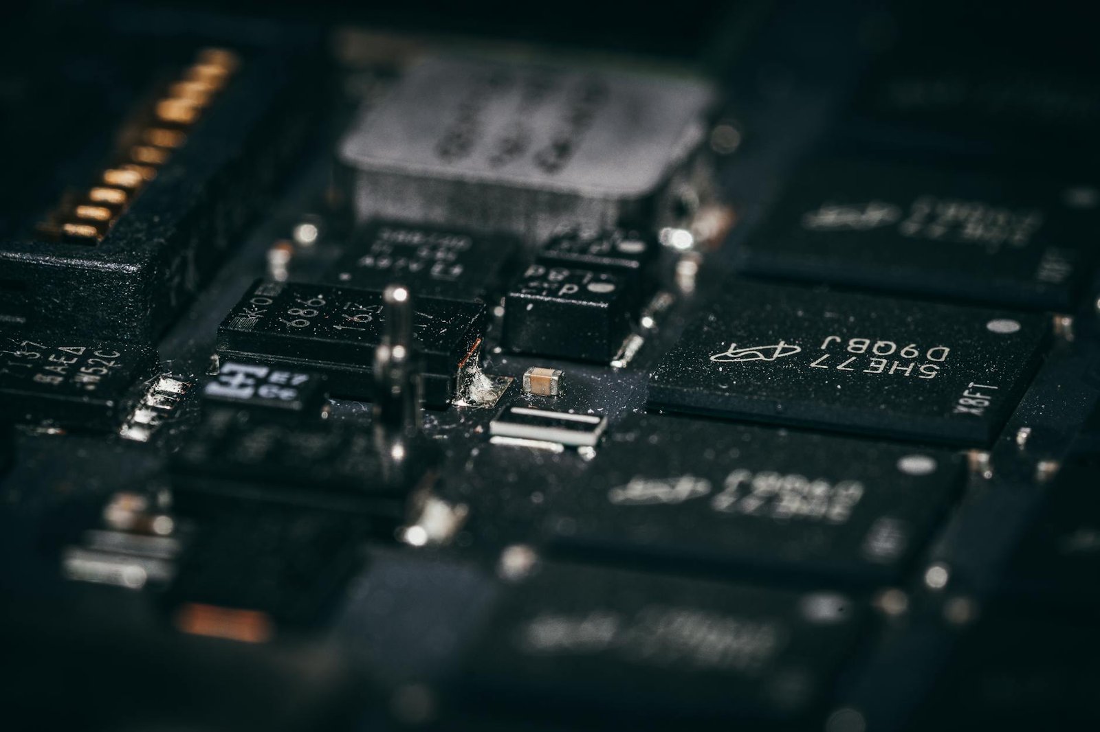 technology - Detailed macro shot of electronic circuit components showcasing intricate design and layout.