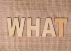 what is fintechzoom - Wooden letters forming the word WHAT set on a textured burlap surface.